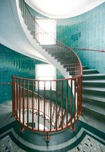 Spiral Staircase With Blue Wall And Red Railing