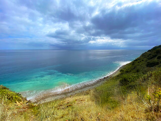 Wall Mural - coastal ocean shore blue harbor cove water sea seashore weather clouds sunshine