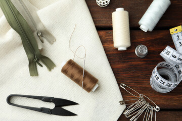 Poster - Threads and other sewing supplies on wooden table, flat lay