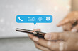 © RoBird - Contact us or Customer support hotline people connect. Business people using a smartphone with the (email, call phone, mail) icons.