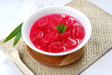 Wall Mural - manisan kolang kaling ,preserved sugar palm fruit,tinted red with red syrup and paste  .an indonesian typical refreshment and dessert during ramadan month and hari raya idul fitri