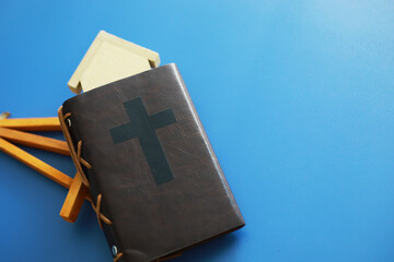 Wall Mural - Book with the symbol of the cross. Bible study. Religious book. Prayer.