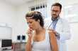 © Graphicroyalty - Young female patient in the clinic suffered from pneumonia, she is coughing the doctor listens to the wheezing in the lungs with a stethoscope.