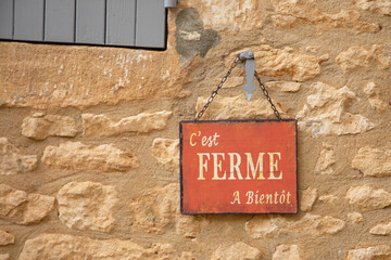 Wall Mural - closed see you soon french text means c'est ferme a bientot in france language on wall store text sign board on facade shop