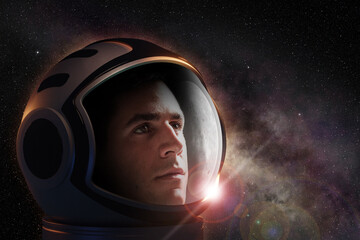 Wall Mural - head shot of astronaut wearing a helmet looking at the deep space. concept of space travel and explo