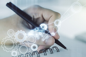 Aufkleber - Double exposure of robotics technology hologram and man hand writing in notebook on background. Research and development software concept