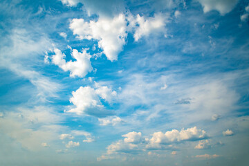 Wall Mural - Background with high blue sky and white clouds. Summer sky with cumulus clouds.