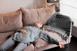 © Tatyana Gladskih - Tired middle-aged woman collapsed on the sofa