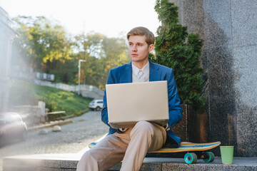 Freelancer young man businessman working on laptop