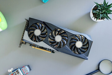 Fototapete - Graphics card on desk. Top view, flat lay composition. Gaming and content production hardware