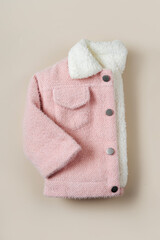 Wall Mural - Kids pink fur jacket. Stylish childrens outerwear. Baby fashion outfit