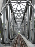 Fototapeta Most - Perspective view of the steel railway bridge.