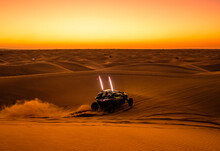 Offroad Safari In Sand Desert, Empty Quarter Desert In United Arab Emirates. Offroad Buggy In Dunes Of Rub’ Al Khali Desert After Sunset.