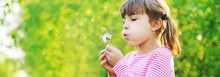 Cute Girl Blowing Flower