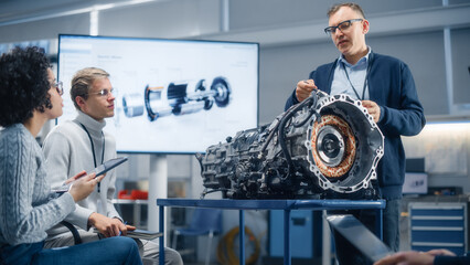 Poster - Diverse Specialists Gathering around Engine and Discussing it with Male Chief Engineer During Seminar. Research, Development, Visualisation, Digitalisation of Green Electric Energy Concept.