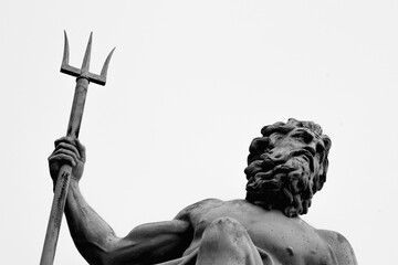 Wall Mural - The mighty god of water, sea and oceans Neptune (Poseidon, Triton). Neptun's trident as symbol strength, power and unrestraint. Fragment of an ancient statue. Black and white image.
