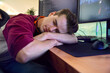 © Monkey Business - Sleeping Man Gaming At Home Sitting At Desk With Multiple Monitors