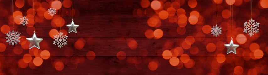 Aufkleber - Christmas ornaments celebration holiday background banner template greeting card panorama - Hanging white ice crystals and silver stars on red abstract wooden wall texture and golden bokeh lights
