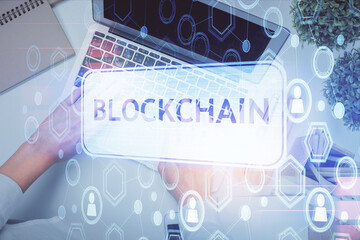 Poster - Double exposure of woman hands working on computer and blockchain theme hologram drawing. Top View. bitcoin cryptocurrency concept.
