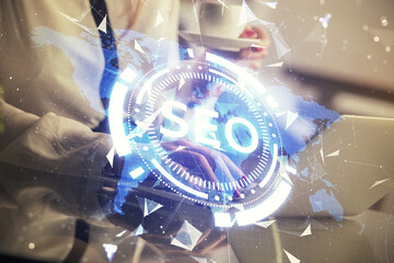 Poster - Double exposure of woman hands working on computer and seo hologram drawing. internet search concept.