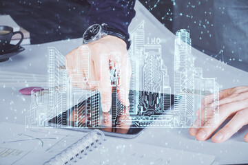 Poster - Double exposure of man's hands holding and using a digital device and city drawing.