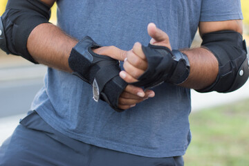 Close-up of man in protective gloves. Sportsmans hand, casual clothes, sport equipment. Sport, hobby concept