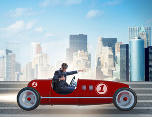 Wall Mural - Businessman riding vintage roadster in motivation concept