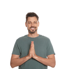 Wall Mural - Man with clasped hands praying on white background