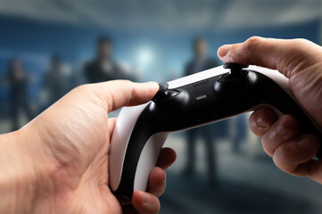 Sticker - Video games. A gamepad in the hands of a gamer against the backdrop of a video game on a large plasma TV screen. Funny online games with friends, prizes, win, game strategy.