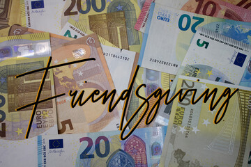 Poster - Friendsgiving word with money. Paper currency background with different banknotes.