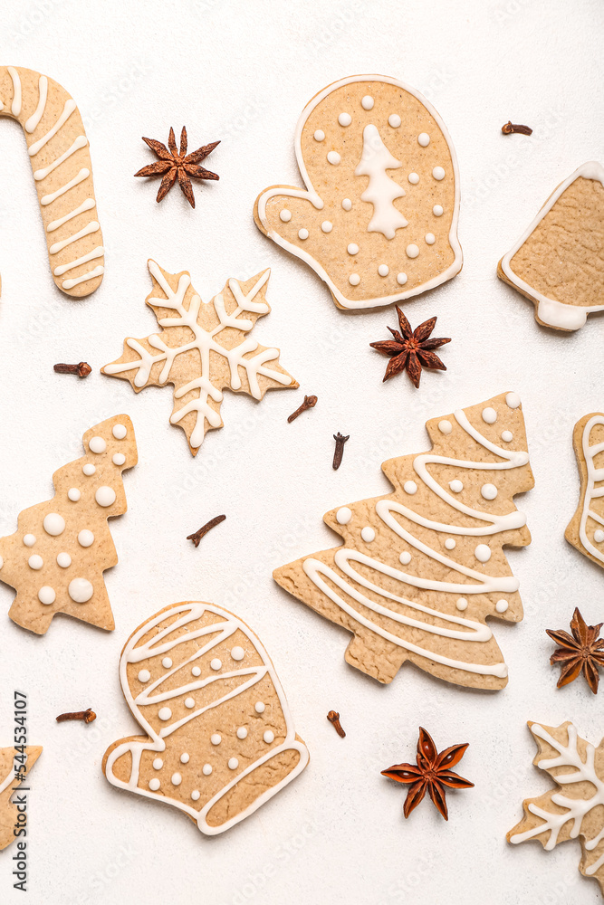 Composition with tasty Christmas cookies and spices on light background