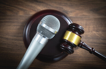 Wall Mural - Judge gavel and microphone on the wooden table. Concept of Auction