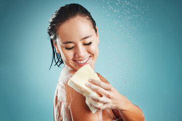 Sticker - Studio, skincare and woman in shower with sponge isolated on a blue background mockup. Water splash, cleaning or healthy hygiene of female model bathing, washing or showering for beauty and body care