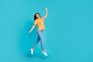 Wall Mural - Full length photo of overjoyed lady dressed trendy orange clothes arm hold empty space black friday sale isolated on blue color background