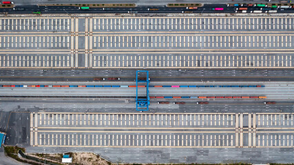 Wall Mural - Aerial view of shipping container rail terminal, Train wagon cargo container for shipping, Aerial view of container terminal on railway.