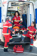 © zinkevych - EMS workers in the red uniforms involved in a conversation