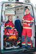 © zinkevych - Paramedical staff posing for the camera in the EMS vehicle