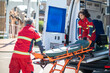 © zinkevych - Paramedical workers taking a stretcher out of the EMS vehicle