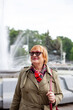 © DariaTrofimova - Old woman in stylish clothes   walking on   street.