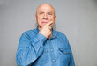 © DariaTrofimova - Mature man wearing  denim shirt  on grey background
