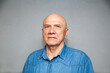 © DariaTrofimova - Mature man wearing  denim shirt  on grey background