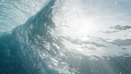 Poster - Underwater view of the ocean wave breaking on the shore in the Maldives at sunset