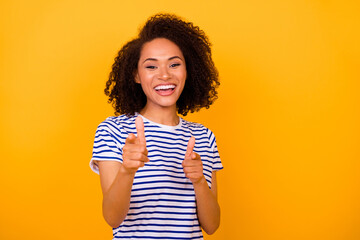 Photo of pretty excited lady wear white t-shirt pointing fingers you empty space isolated yellow color background