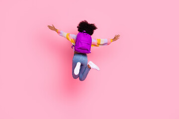 Sticker - Full length photo of excited funny little child dressed pastel pullover jumping high arms sides isolated pink color background