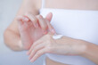 © BoszyArtis - hands skin protection. closeup asia woman applying protective cream on hand.