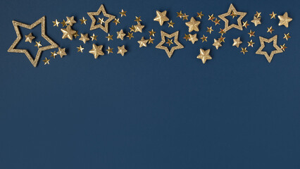 Gold shiny stars on a blue background.