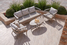 Comfortable Leisure Sofa With Cushions And Table In A Green Garden During Sunny Vacation, Shot From Above


