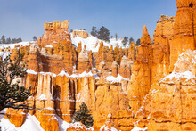 Cold Winter In Bryce Canyon National Park, Close-up On Unique Rock Formations In Utah Covered In Snow, Orange Rocks In Snow, Cold Winter In The Usa