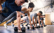 © N F/peopleimages.com - Strong, fitness and gym people with dumbbell teamwork training or exercise community, accountability and group. Sports diversity friends on floor in pushup muscle workout, power and wellness together