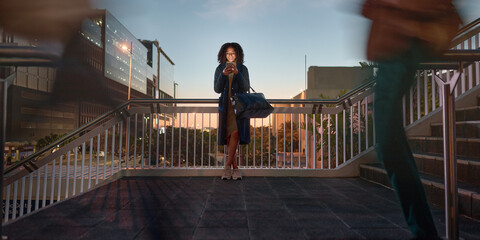 Fototapete - Woman, phone and typing at night in city, social media or text message. Tech, mobile or black female on 5g smartphone in busy town, web browsing or networking, texting online or checking email on app